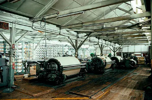 Raw fabric bales being processed in the factory